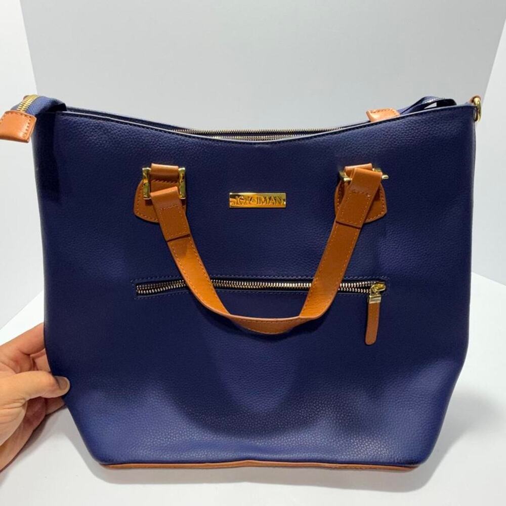 Joy & Iman Navy blue leather tote bag with tan leather accents and gold hardware